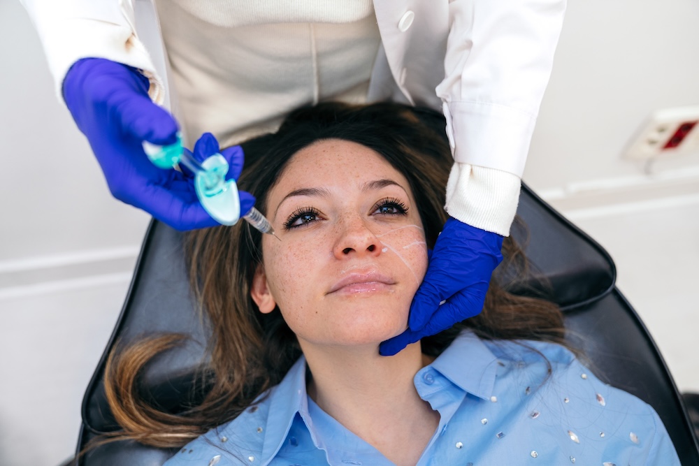 Woman receiving dermal filler treatment