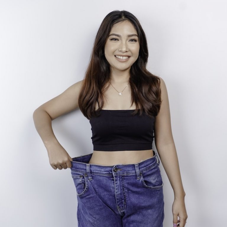 Woman happy with the results of her weight loss programs