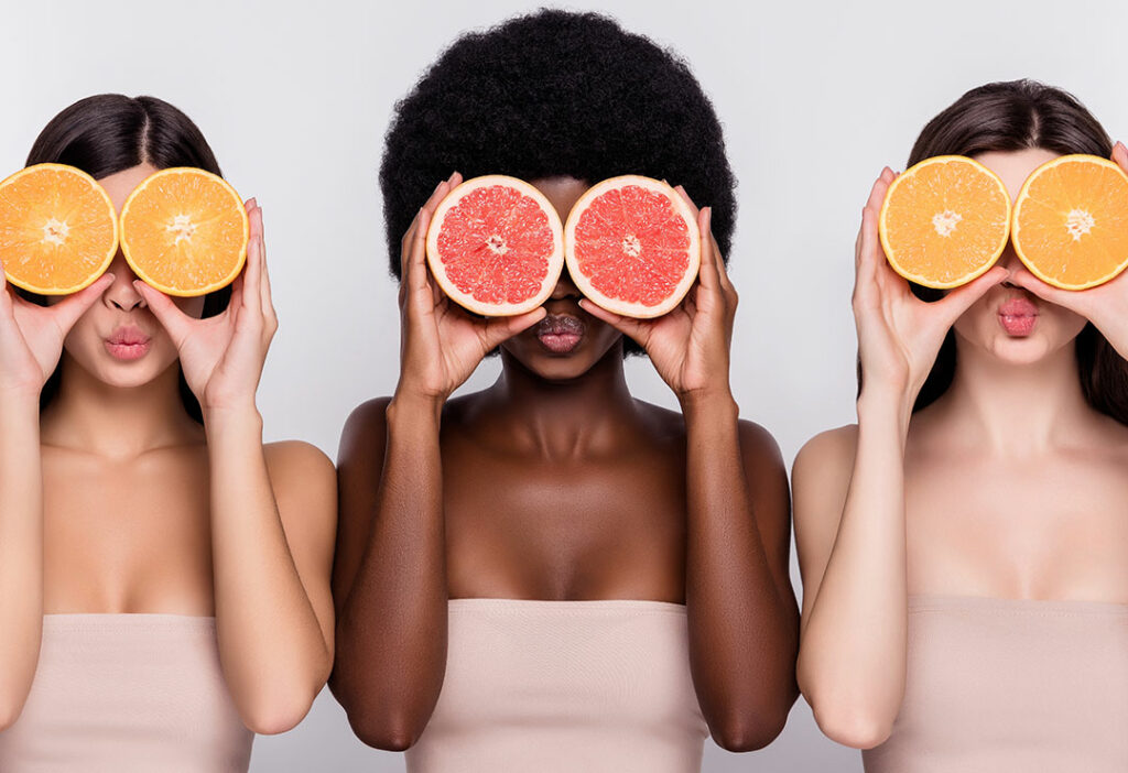 IV Hydration | Women holding citrus fruits with great skin