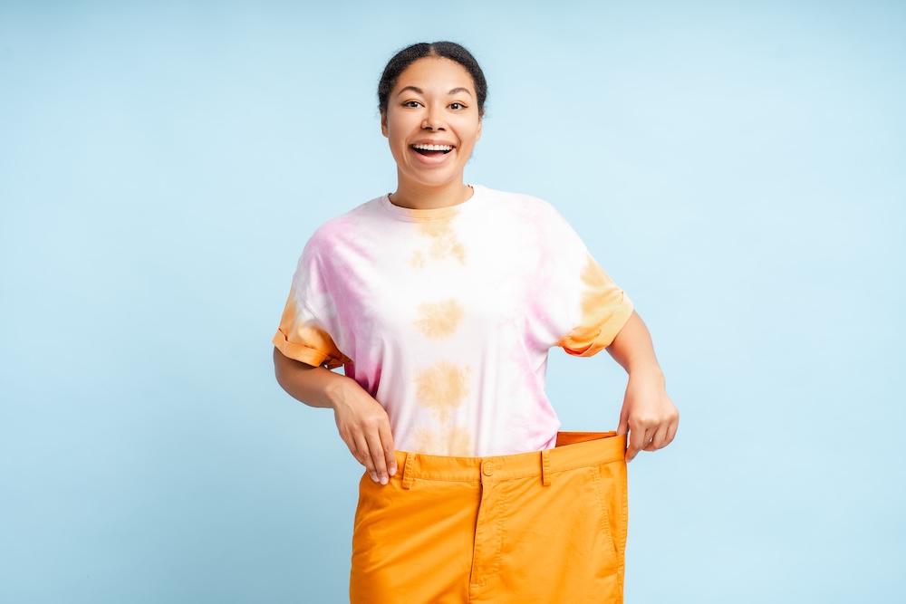 Excited woman with weight loss results from medical weight loss kansas city