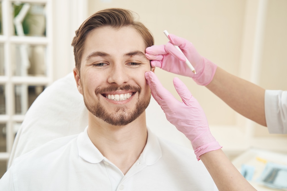 A man receiving dermal fillers in Kansas City