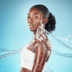 Woman getting water splashed on her iv hydration solutions