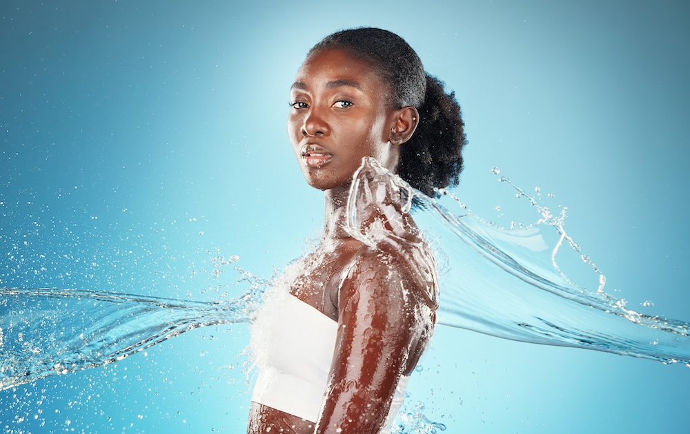 Woman getting water splashed on her iv hydration solutions