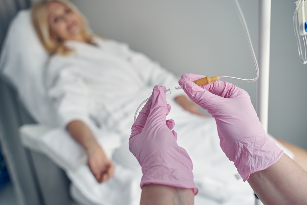 woman relaxing while she receives iv hydration